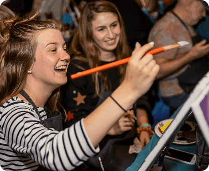 Paint night event showcasing creative artwork and social atmosphere