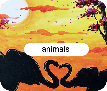 Elephant silhouettes against sunset.